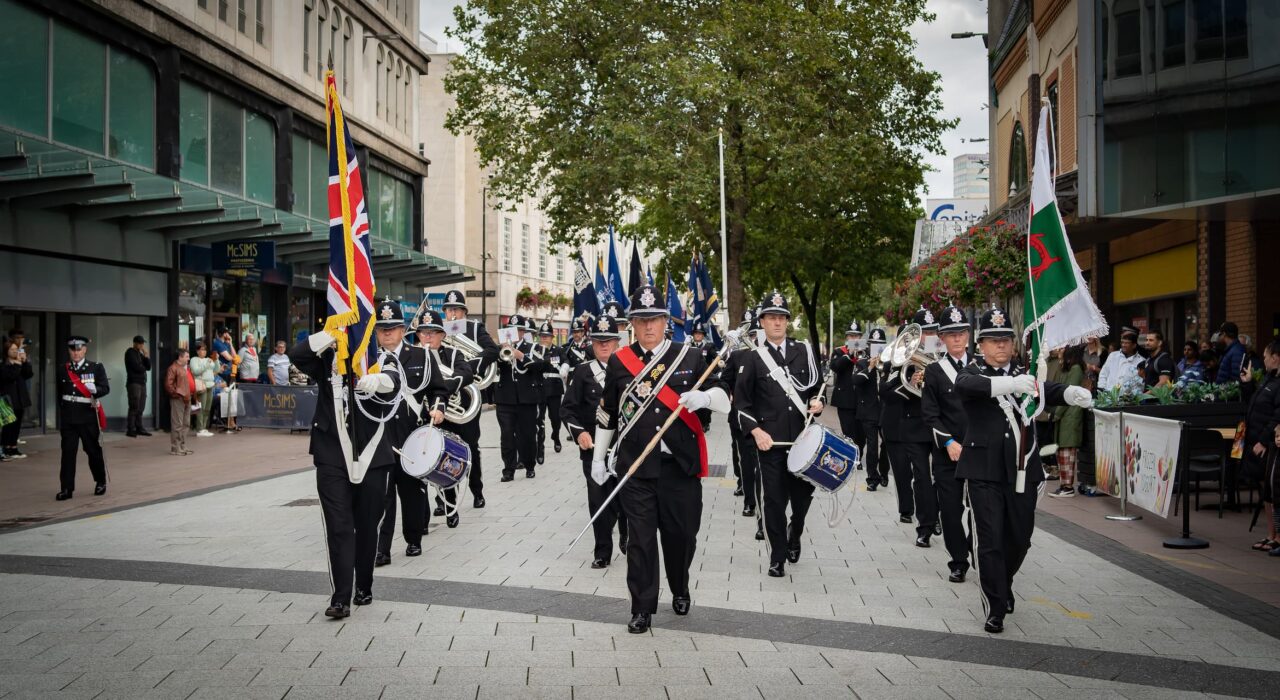 Officers marching in Cardiff as part of National Police Memorial Day 2023